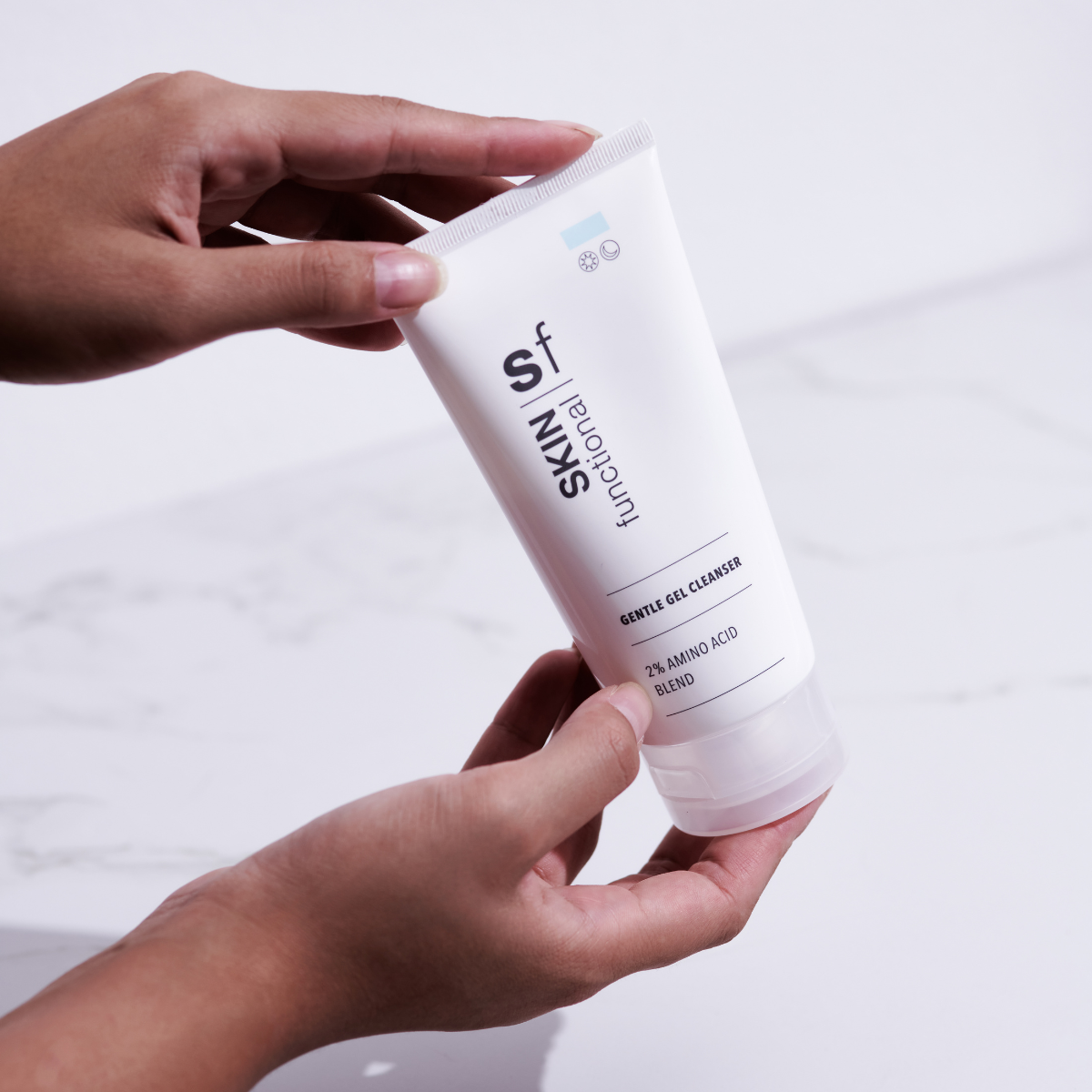SKIN Functional Gentle Gel Cleanser with product details skincare product on a light gray background