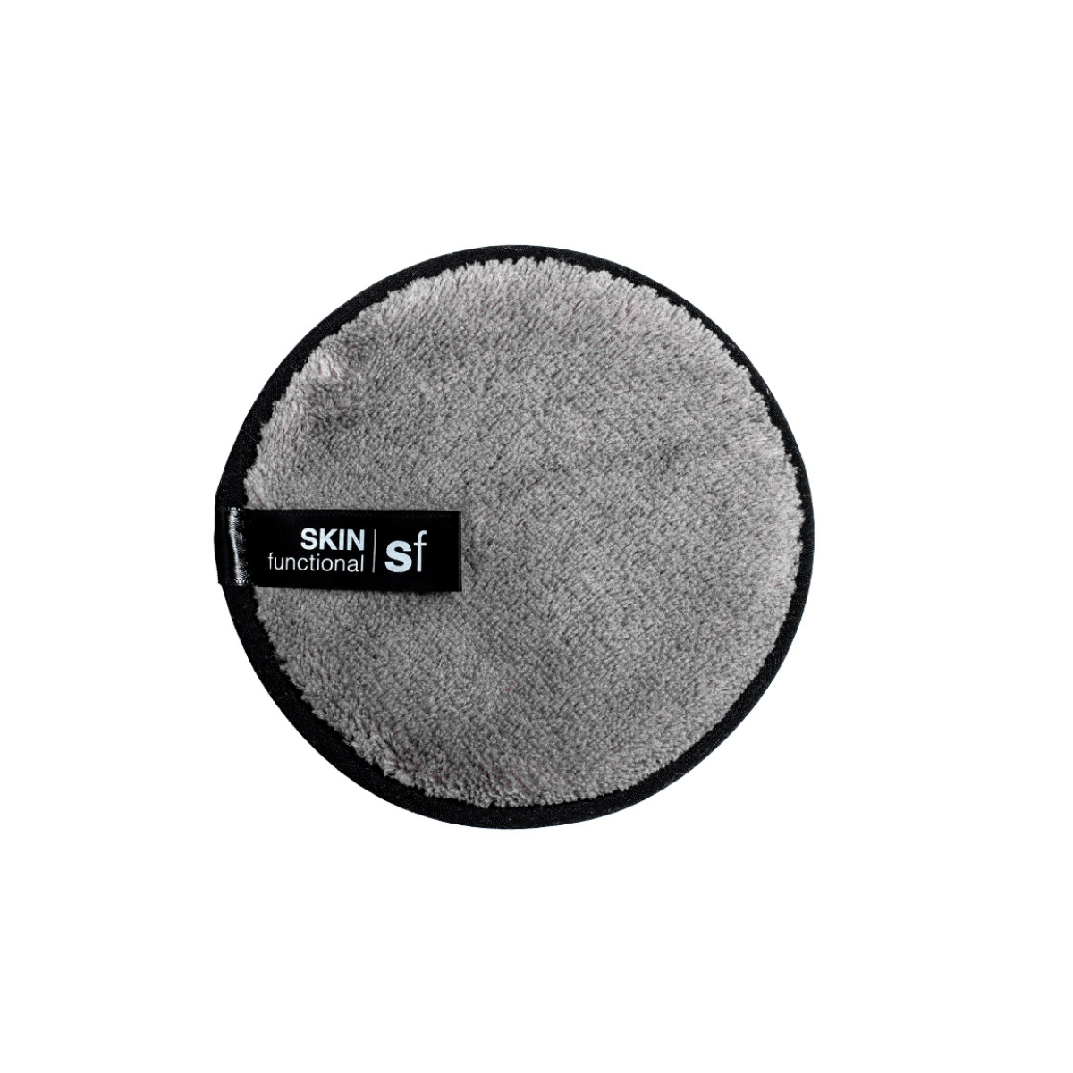 Round gray cleaning pad with 'SKIN functional sf' label on a white background